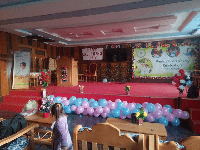 Event hall with stage setup at American Market Booni