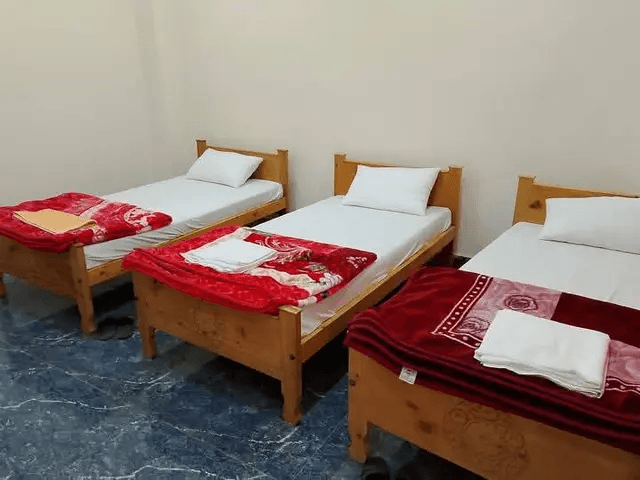 Hotel rooms at Pamir Pearl Hotel inside American Market Booni