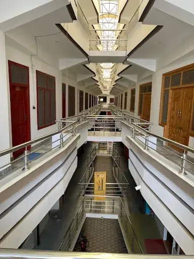 Interior corridor and atrium of American Market Booni commercial plaza